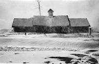 Photograph of chicken barn on Burr farm on Kinne Brook Road. Winter scene with blowing snow.